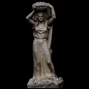 Woman bearing fruit sculpture